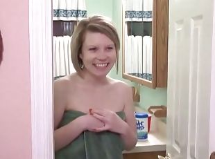 Cute blonde babe masturbates in the shower