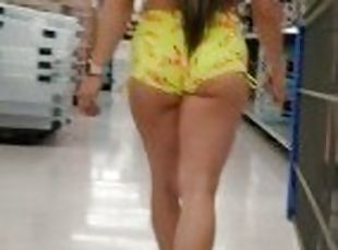 Candid ass in short shorts walking in the store