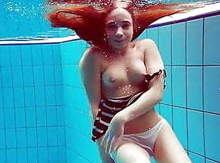 Cute hairy pussy teen Nina in the swimming pool