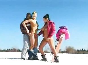 Sexy sluts in the snow do a threesome