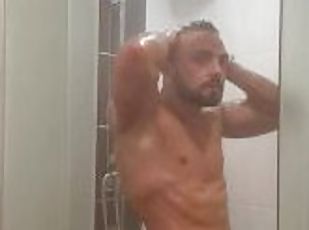 25 years old stud showering his thick cock